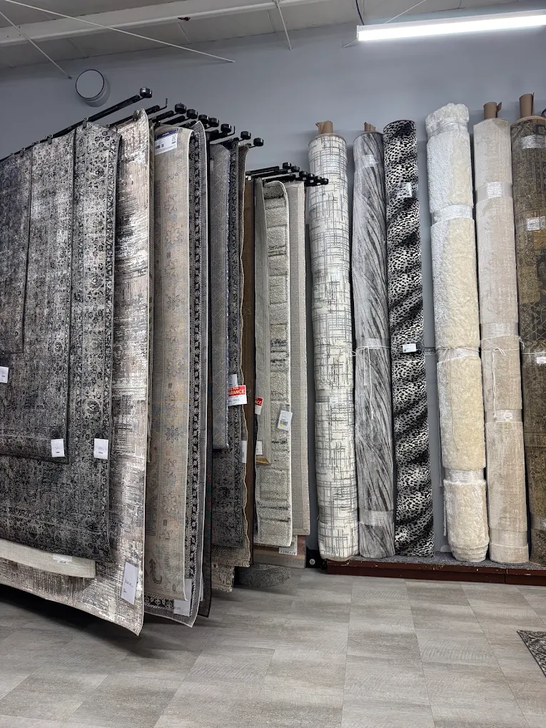 Area rugs and runners in the showroom, ready to layer over hard-surface floors for extra winter warmth.