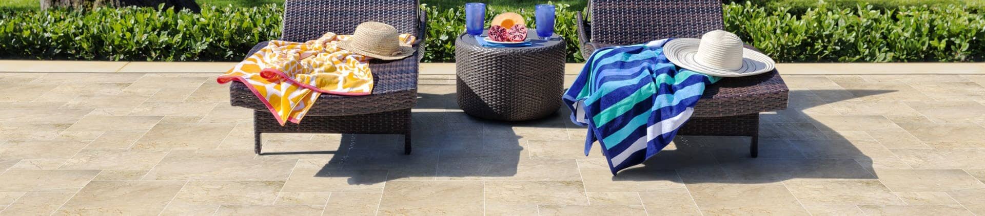 Chaises with towels and hats on them from Mechanic St Jackson, MI 49201